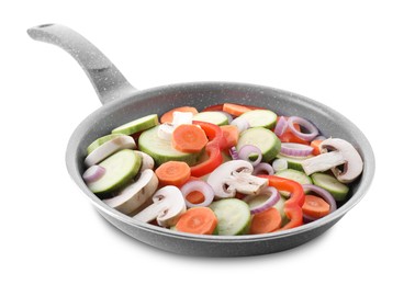 Photo of Frying pan with mix of fresh vegetables and mushrooms isolated on white