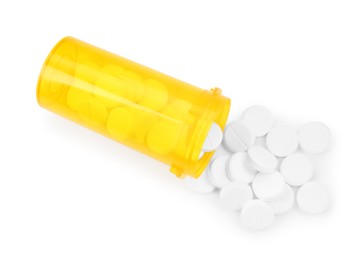 Photo of Medical bottle with antibiotic pills isolated on white, top view