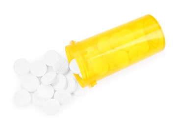 Photo of Medical bottle with antibiotic pills isolated on white, top view