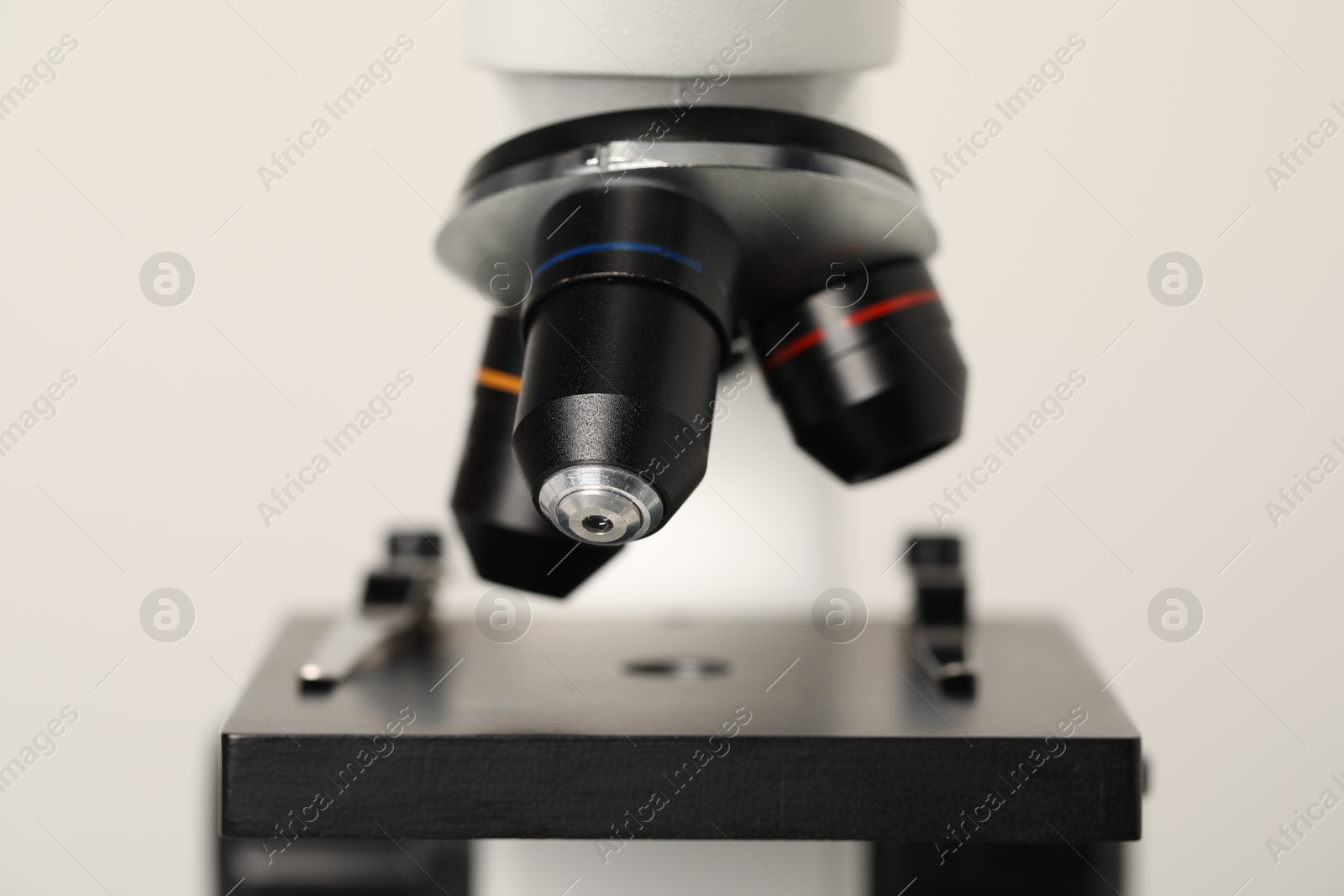 Photo of Science. Modern microscope on light background, closeup