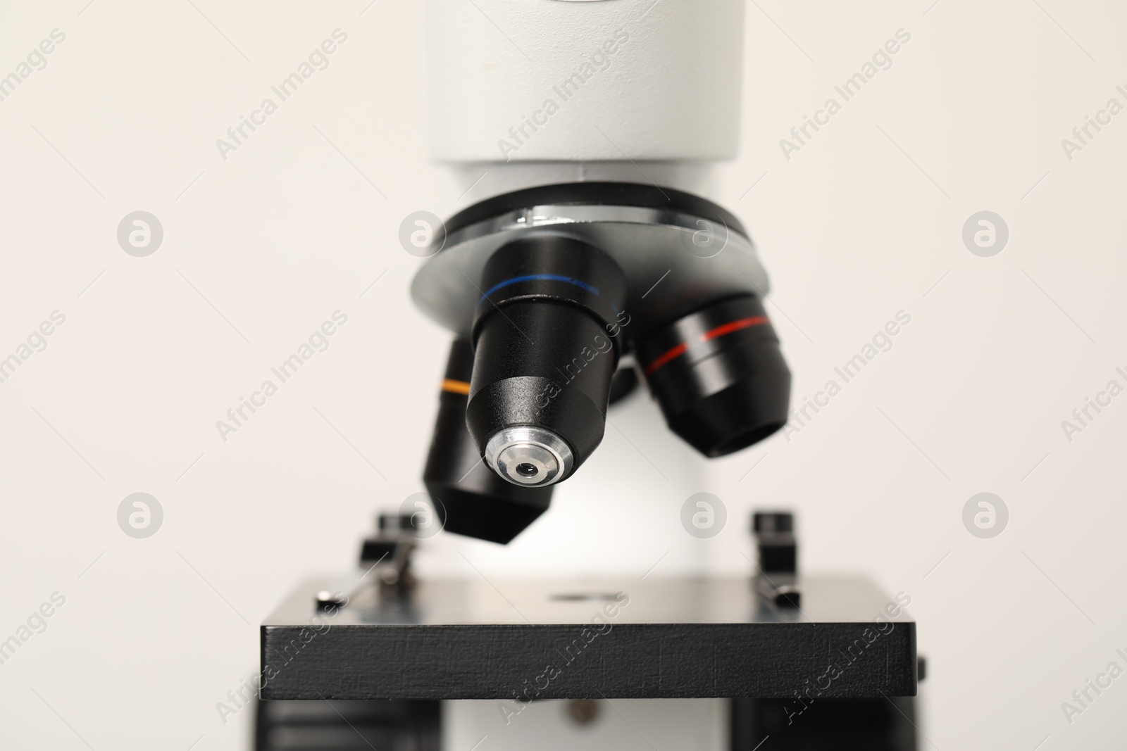 Photo of Science. Modern microscope on light background, closeup