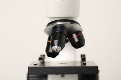 Science. Modern microscope on light background, closeup