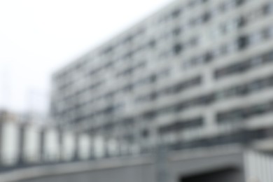 Photo of Blurred view of modern building with many windows outdoors