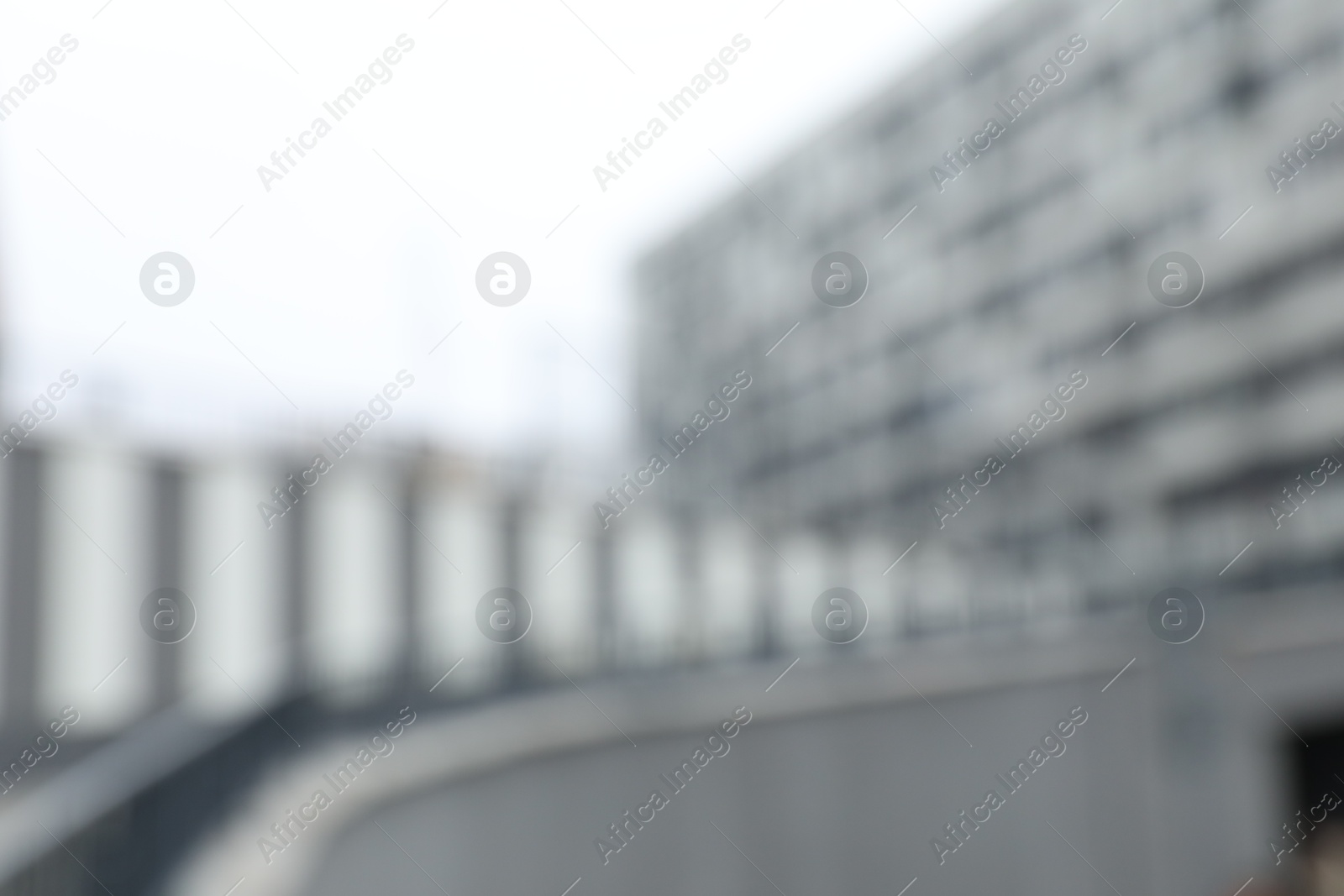 Photo of Blurred view of modern building with many windows outdoors