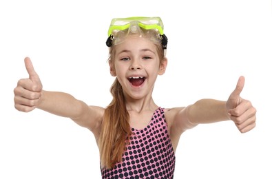 Happy girl in beachwear with diving mask showing thumbs up on white background