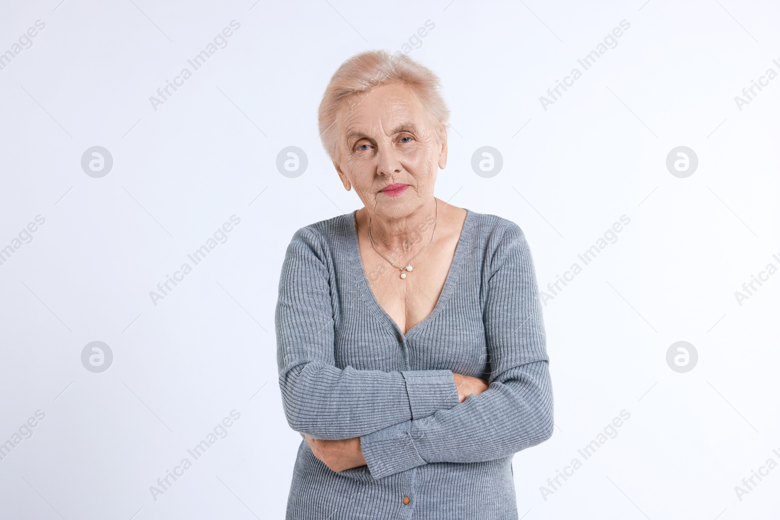 Photo of Portrait of senior woman on white background