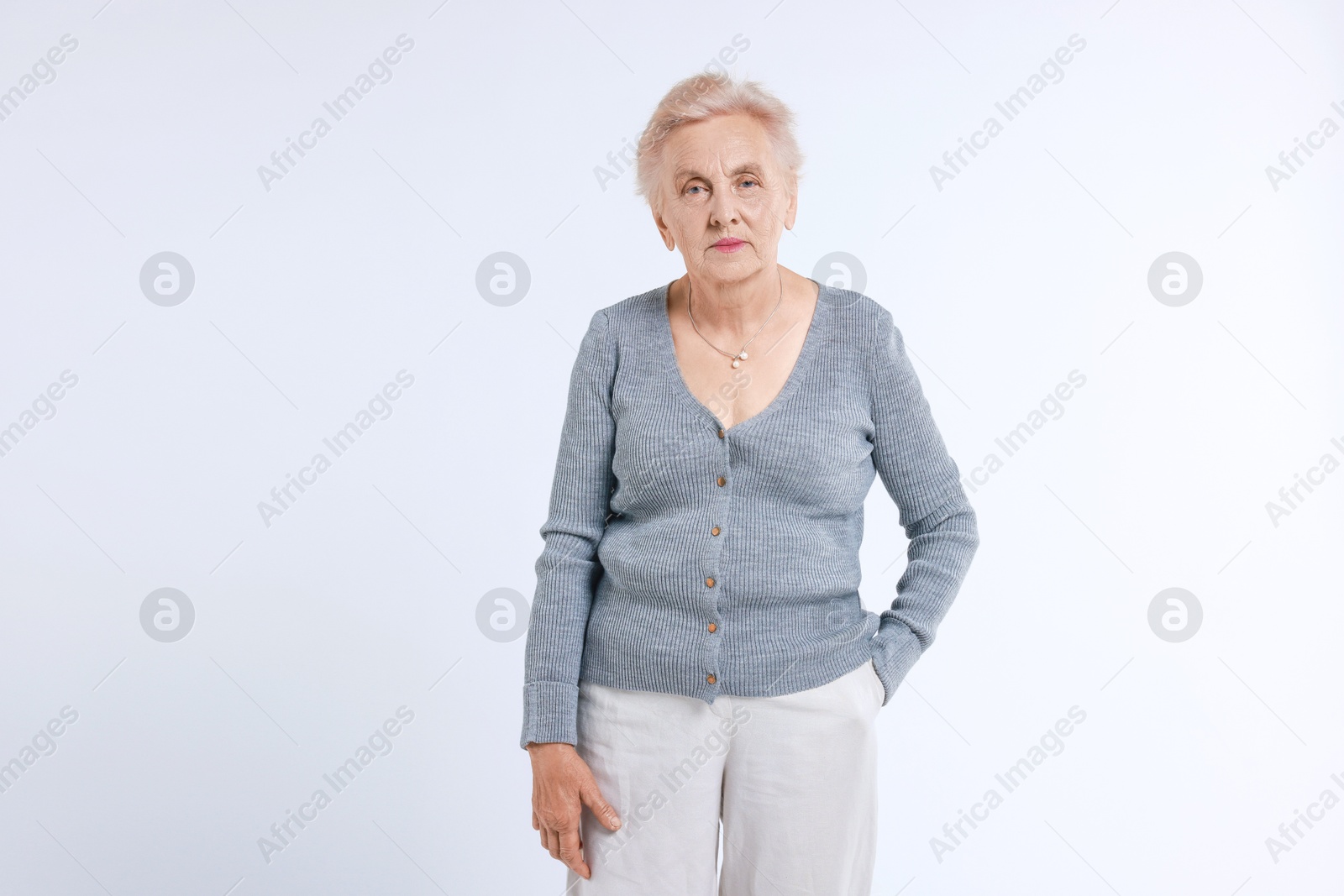 Photo of Portrait of senior woman on white background