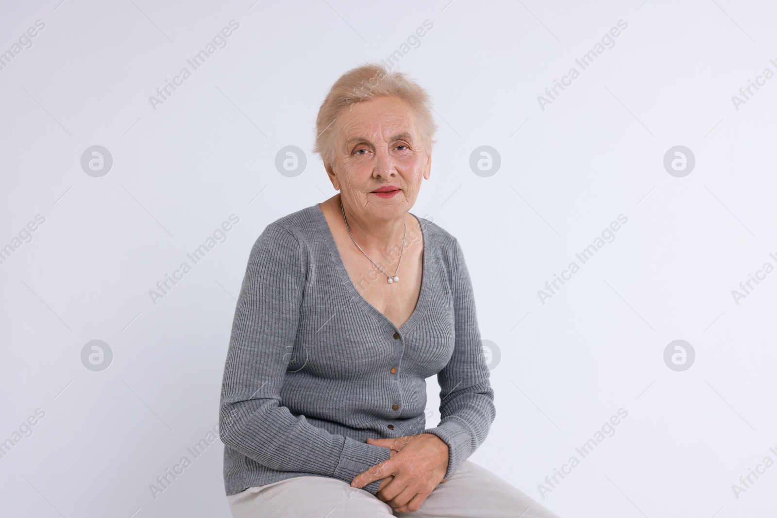 Photo of Portrait of senior woman on white background