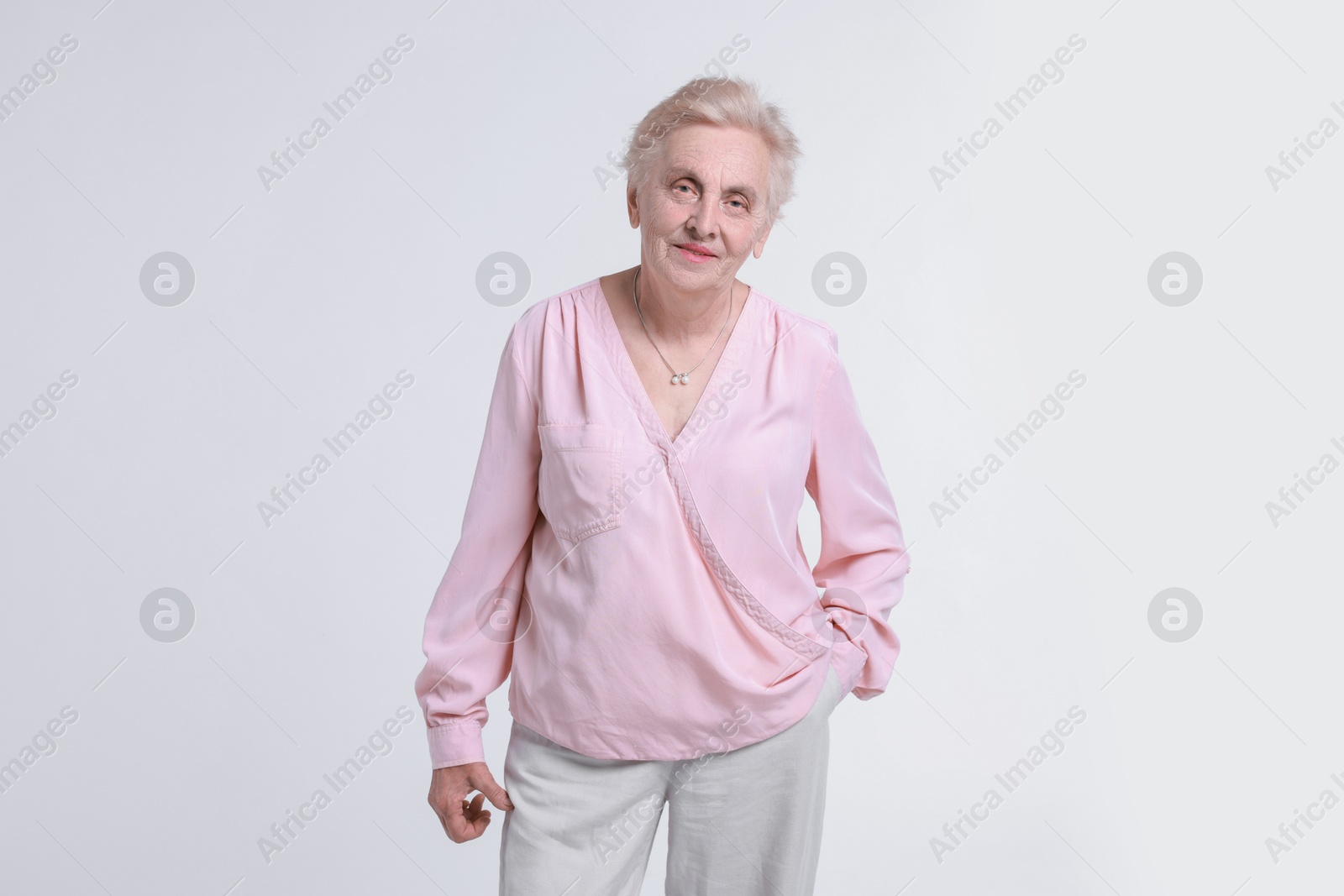 Photo of Portrait of senior woman on white background