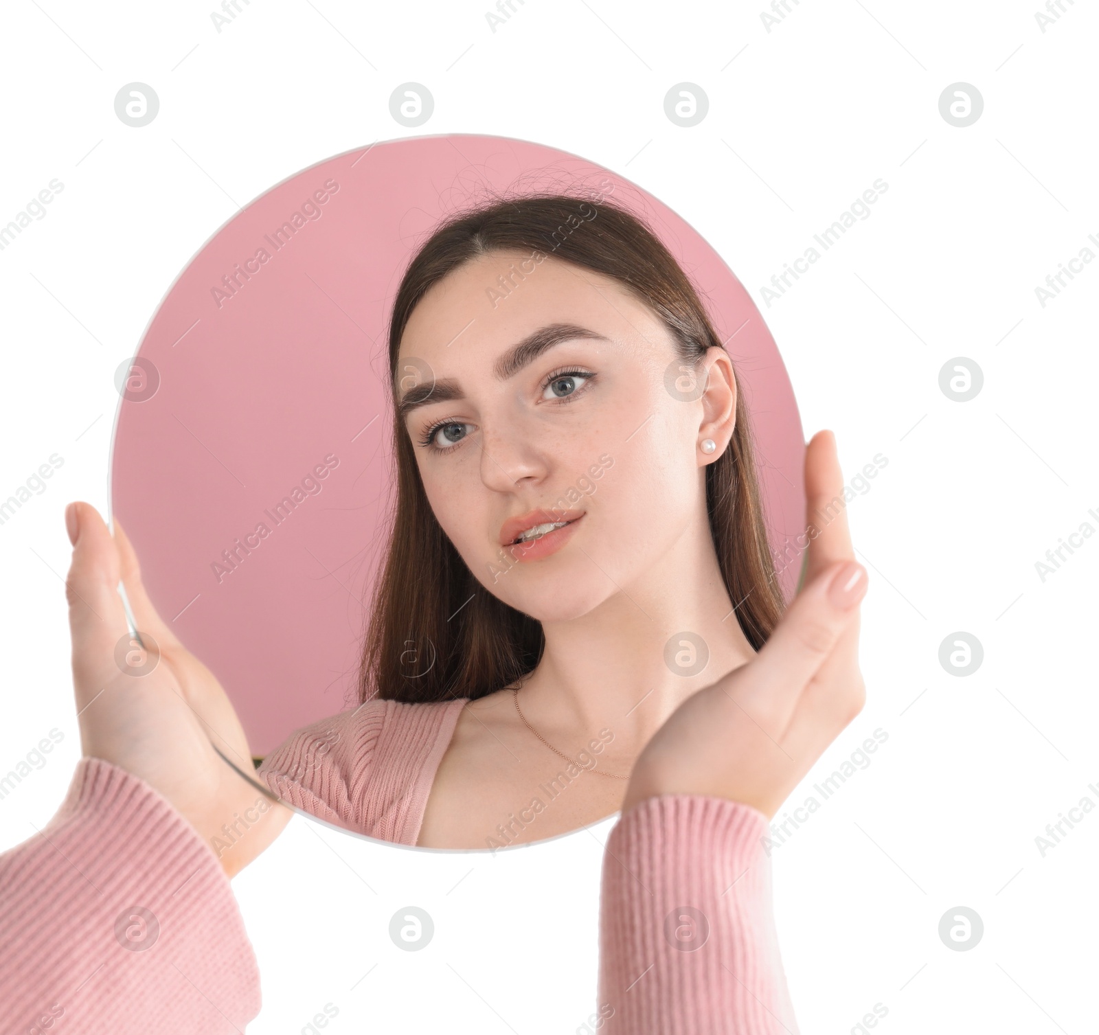 Photo of Woman holding round mirror on white background, closeup