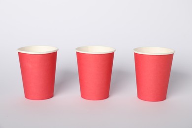 Photo of Paper cups on white background. Mockup for design