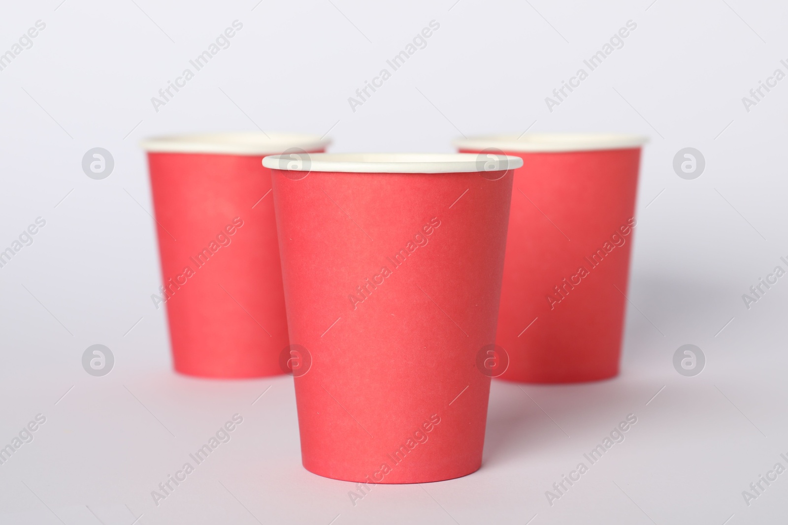 Photo of Paper cups on white background. Mockup for design