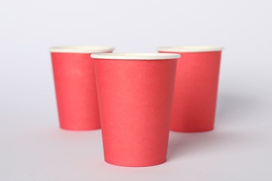 Photo of Paper cups on white background. Mockup for design