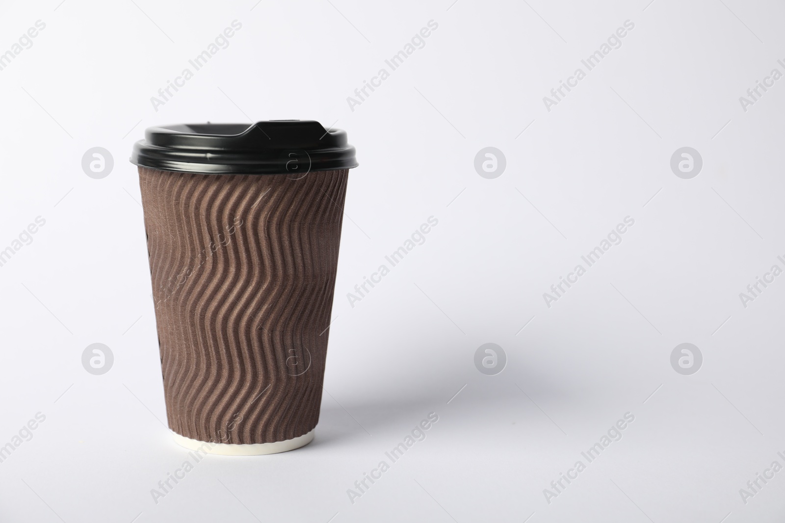 Photo of Paper cup with lid on white background. Mockup for design