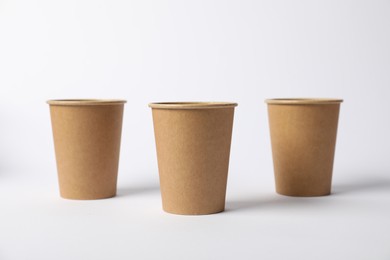 Photo of Paper cups on white background. Mockup for design