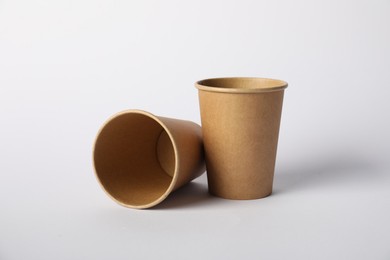 Photo of Paper cups on white background. Mockup for design