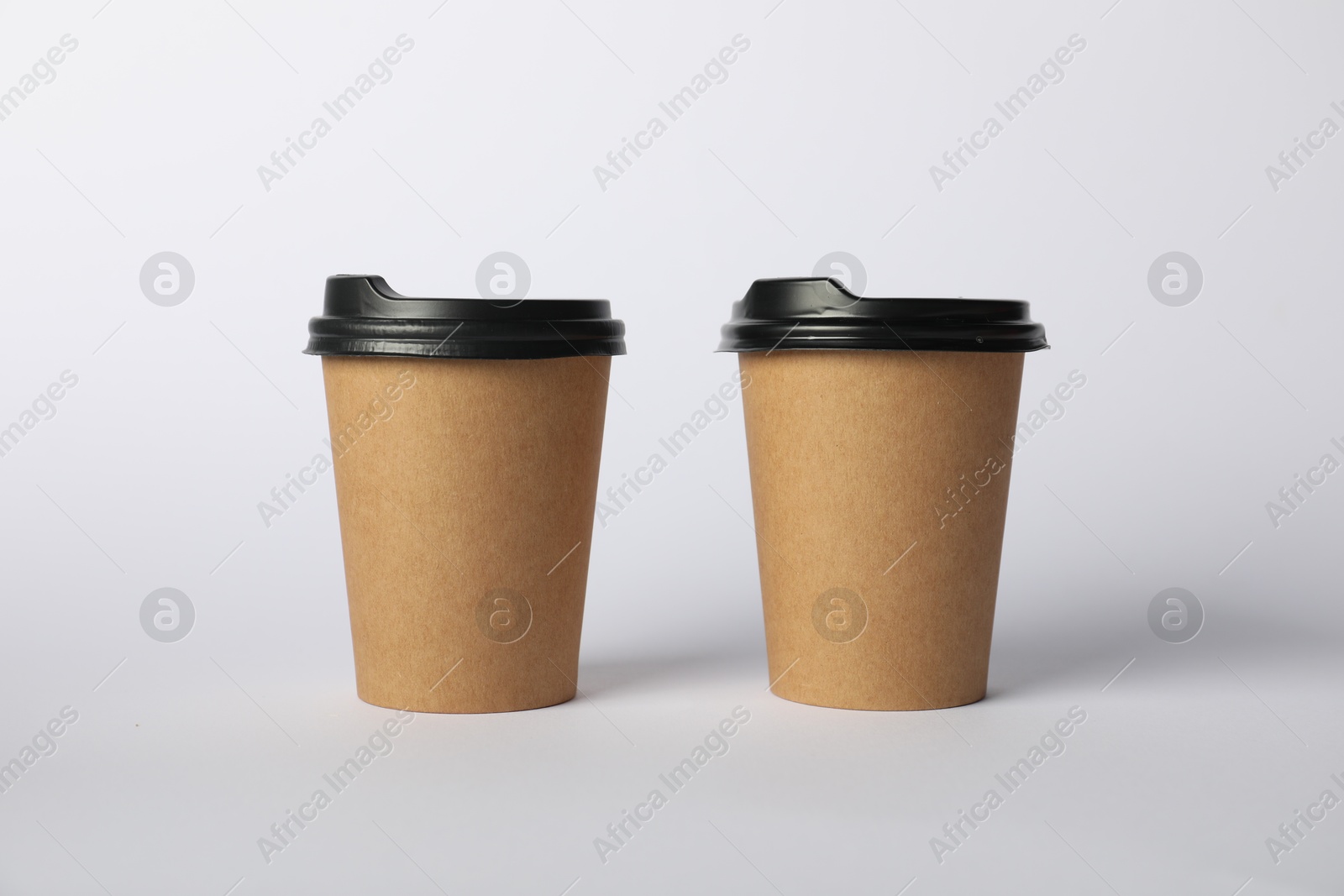 Photo of Paper cups on white background. Mockup for design