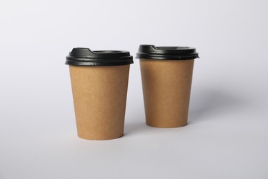 Photo of Paper cups on white background. Mockup for design