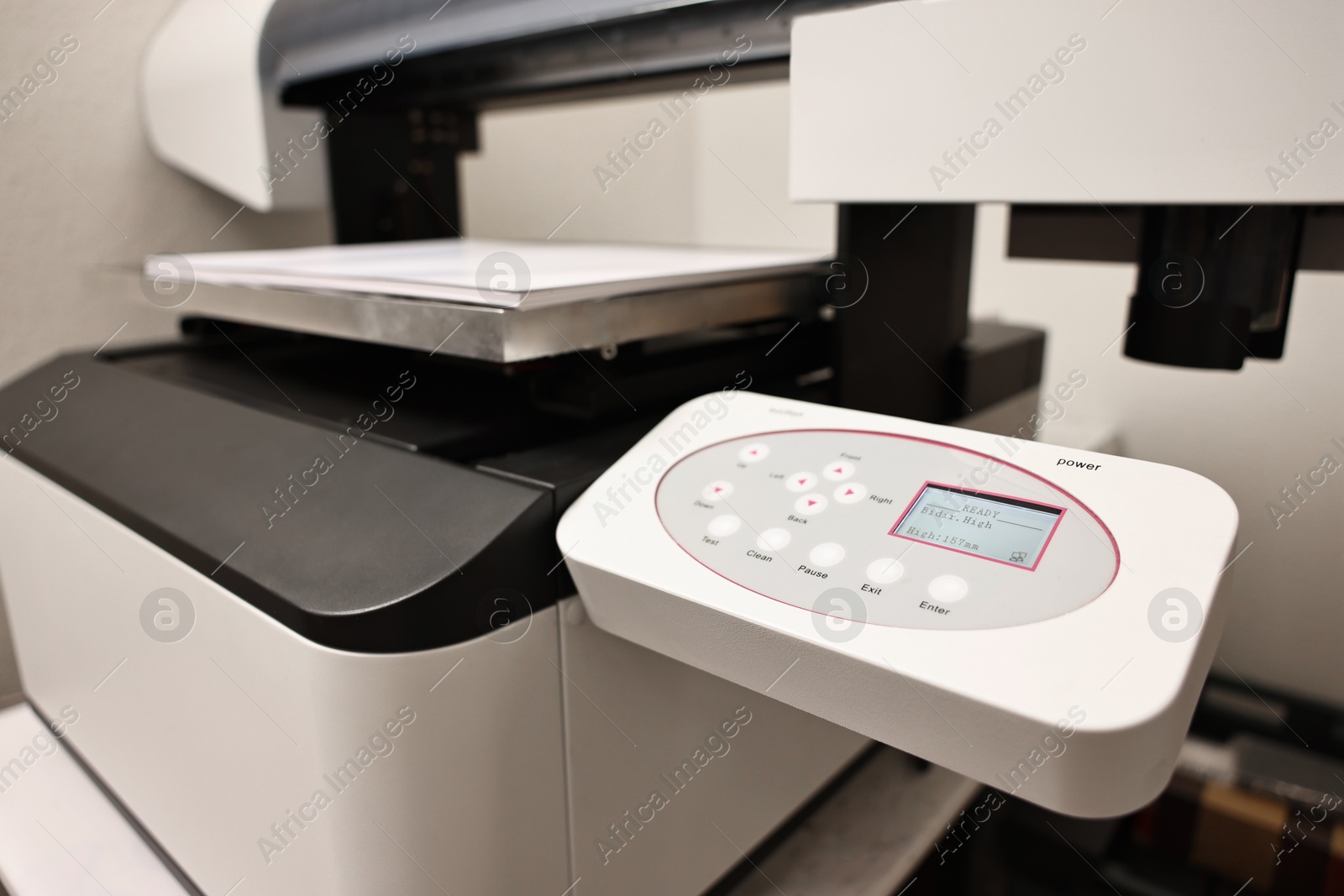 Photo of Modern printer in room, closeup. Printing equipment