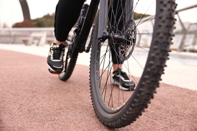 Man with bicycle outdoors, closeup. Healthy lifestyle