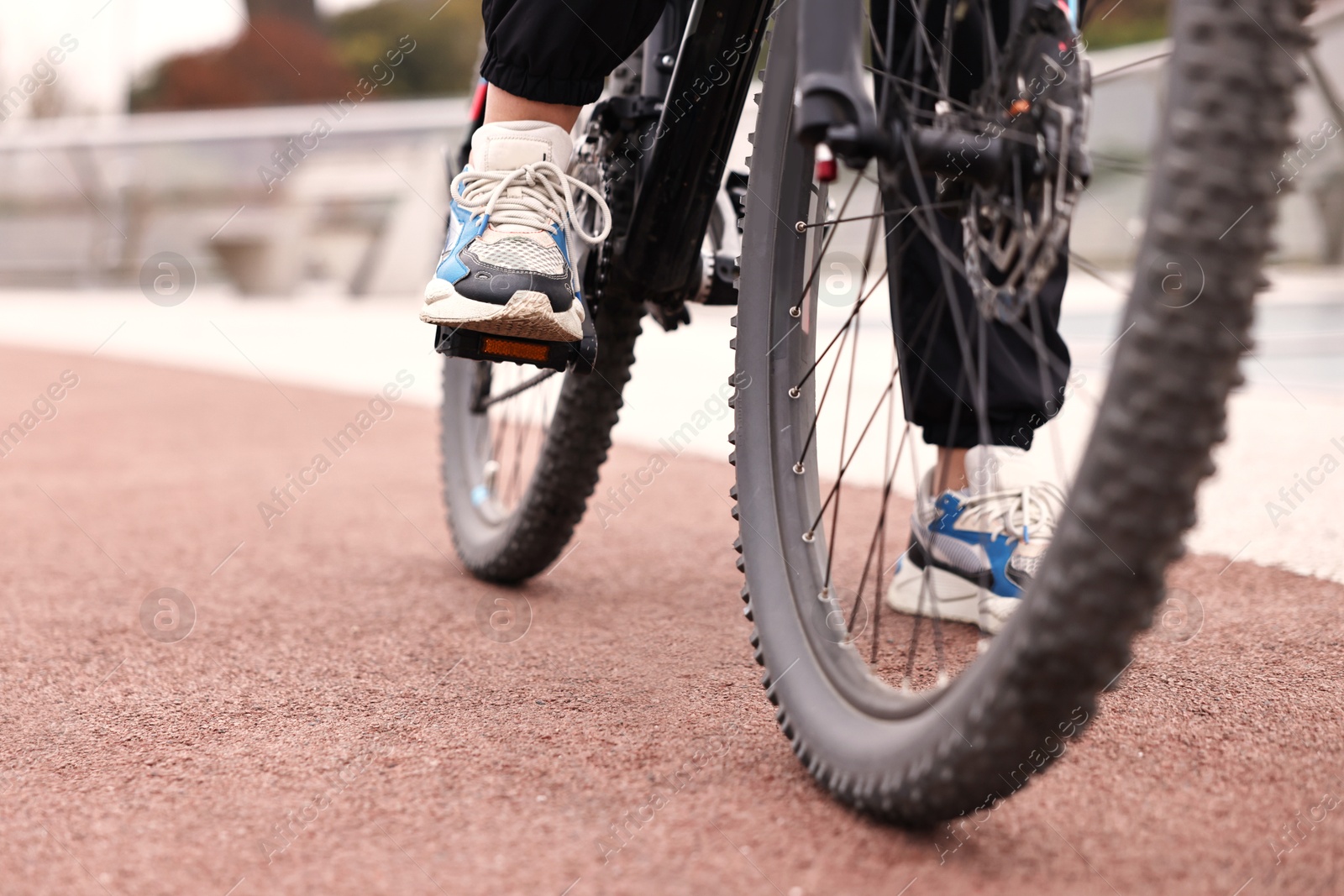 Photo of Woman with bicycle outdoors, closeup. Healthy lifestyle