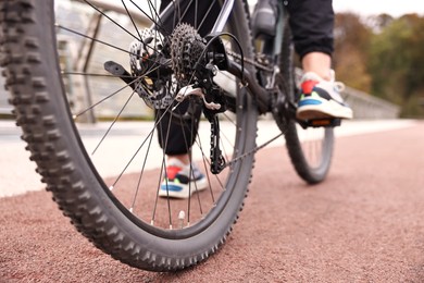 Woman with bicycle outdoors, closeup. Healthy lifestyle