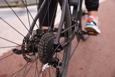 Photo of Woman with bicycle outdoors, closeup. Healthy lifestyle