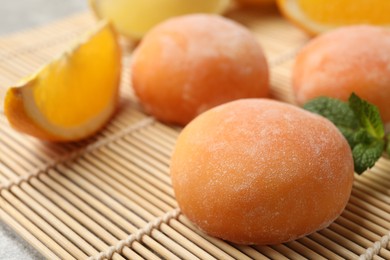 Photo of Tasty mochi on bamboo mat, closeup view