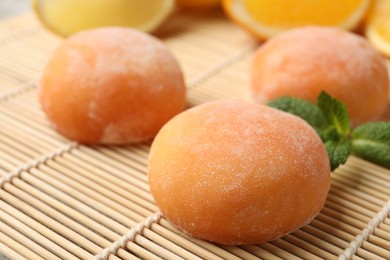 Photo of Tasty mochi on bamboo mat, closeup view