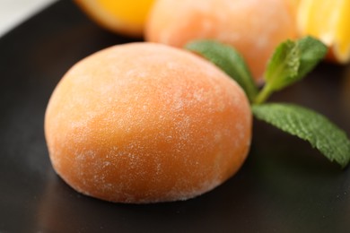 Photo of Tasty mochi and mint on plate, closeup