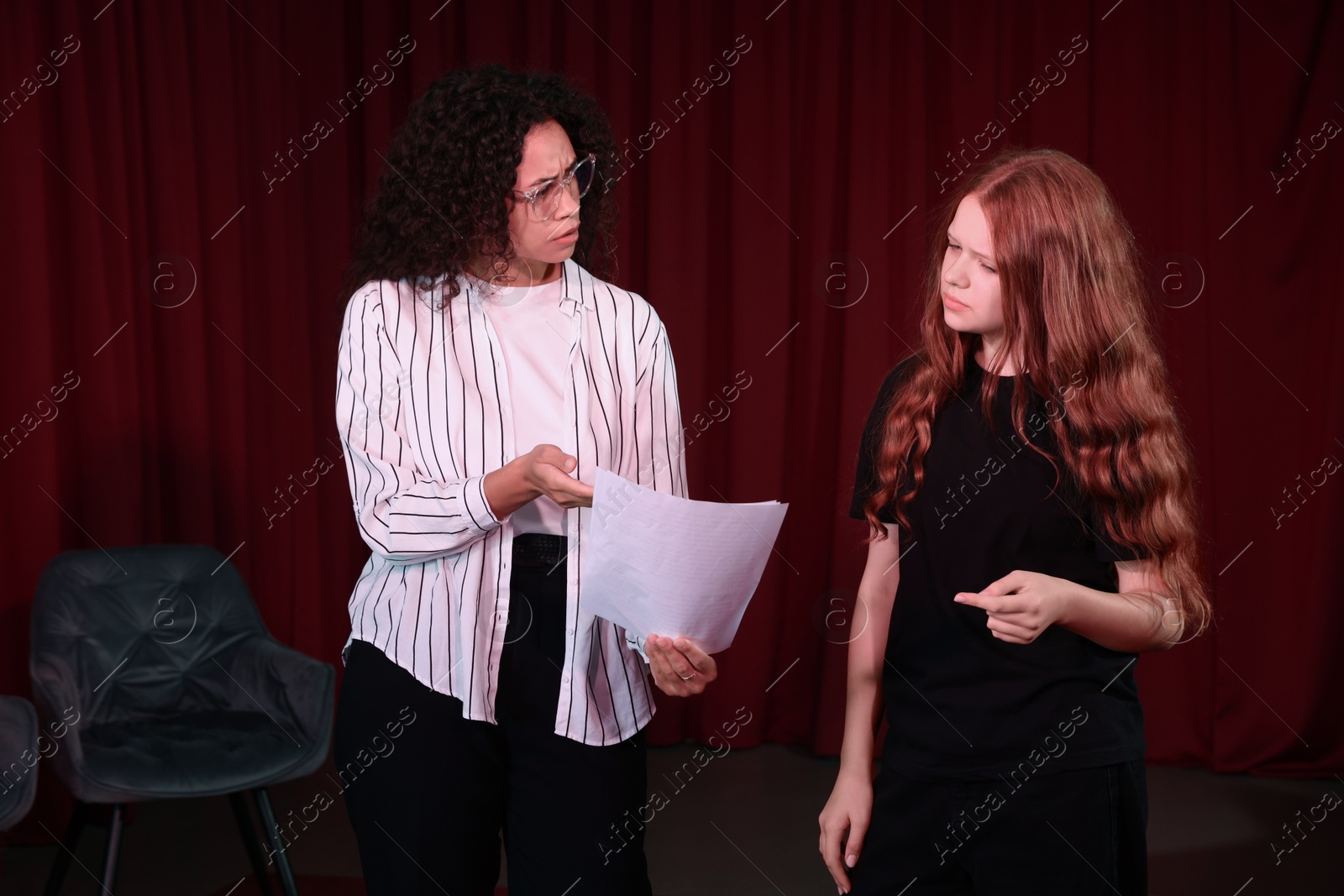 Photo of Professional actors rehearsing on stage in theatre