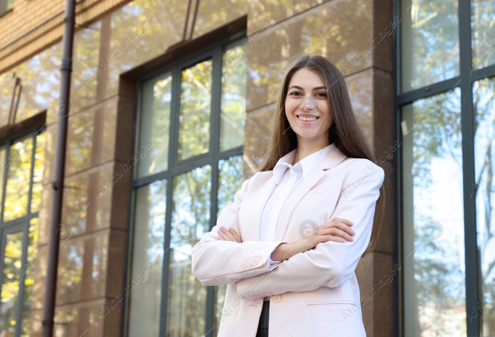 Photo of Portrait of young woman wearing stylish suit outdoors