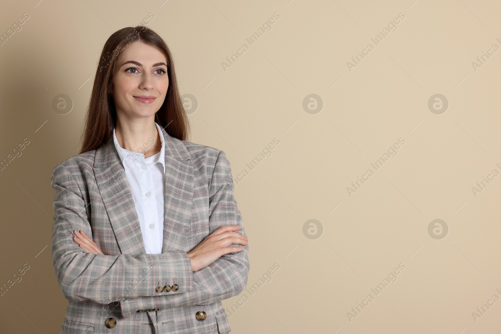 Photo of Portrait of smiling banker on beige background. Space for text