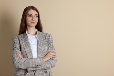 Portrait of smiling banker on beige background. Space for text