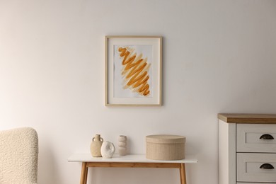 Photo of Stylish console table with decor near white wall indoors