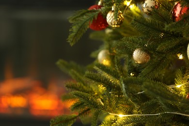 Photo of Beautiful decorated Christmas tree indoors, closeup. Space for text