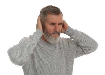 Senior man covering her ears on white background