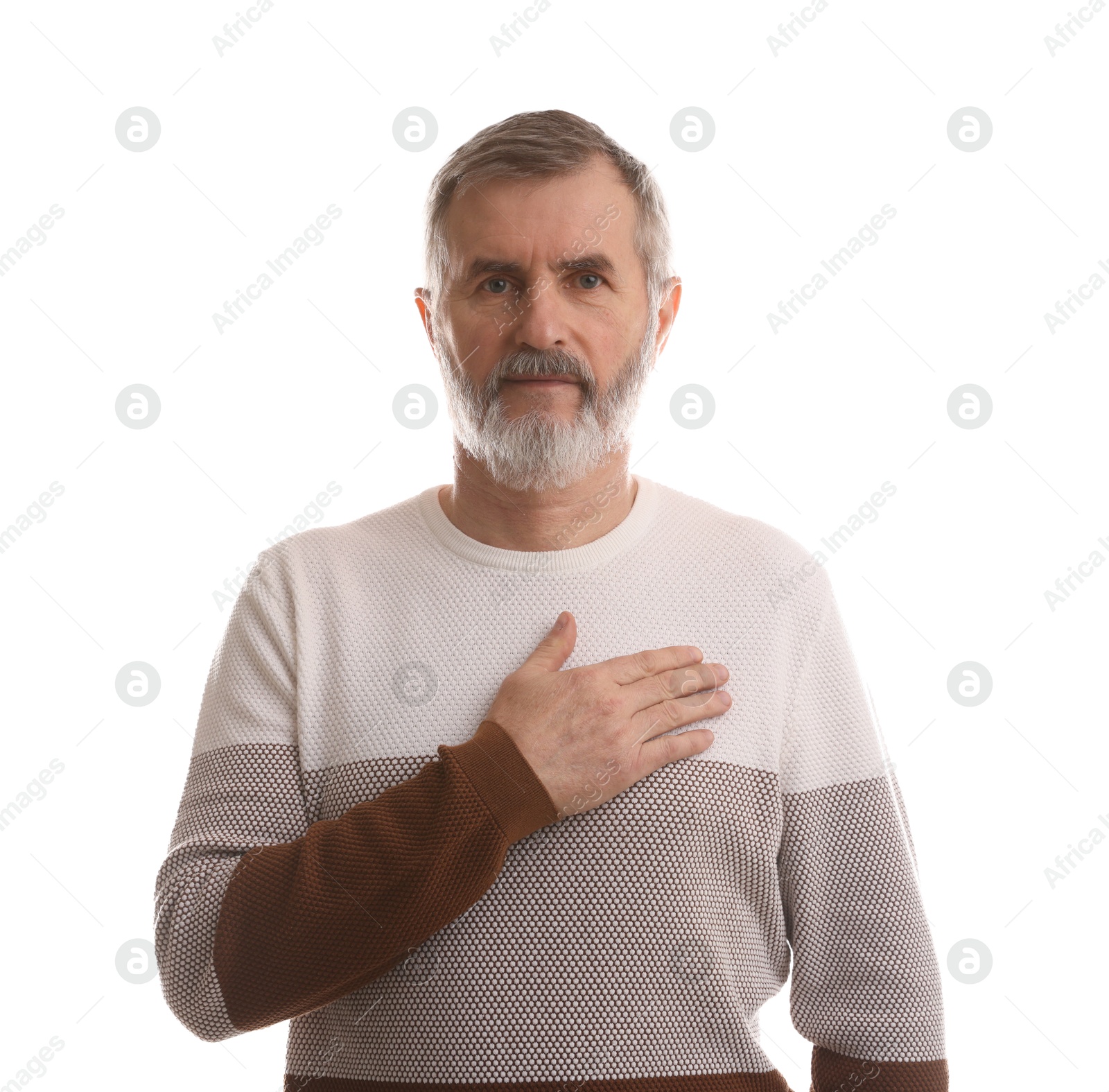 Photo of Mature man making promise on white background. Oath gesture