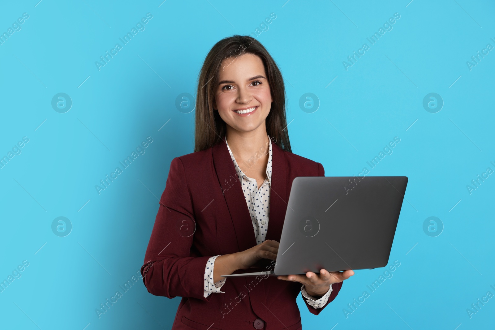 Photo of Banker with laptop on light blue background