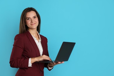 Photo of Banker with laptop on light blue background, space for text