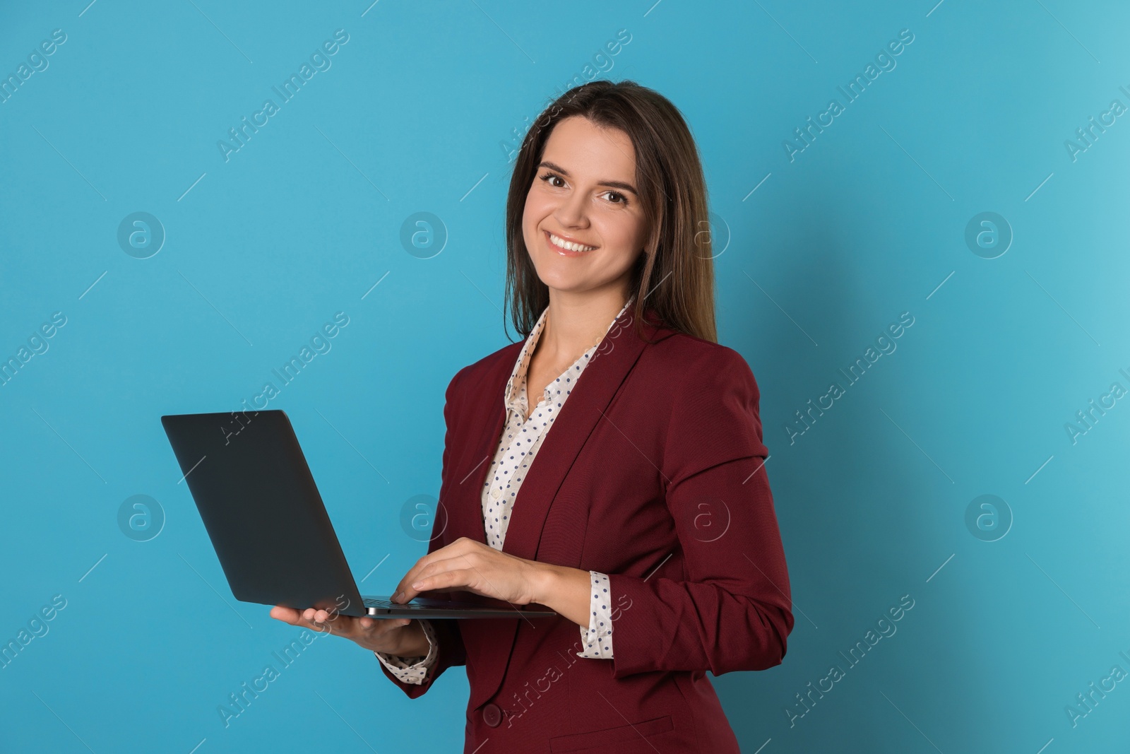 Photo of Banker with laptop on light blue background