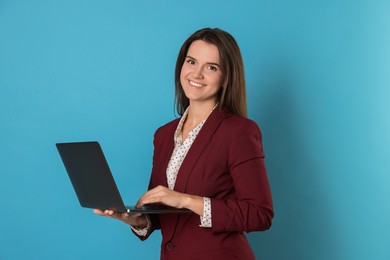 Photo of Banker with laptop on light blue background