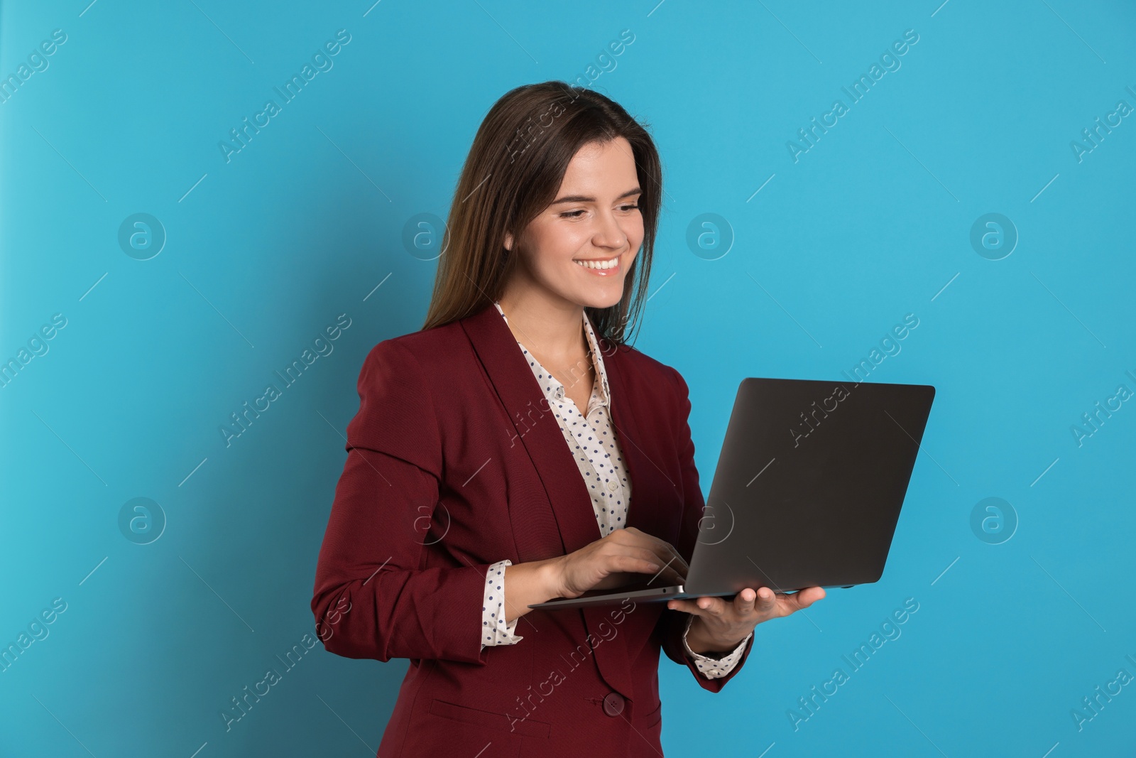 Photo of Banker with laptop on light blue background