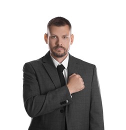 Photo of Man making promise on white background. Oath gesture