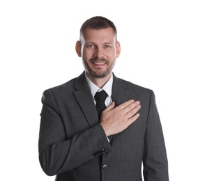 Photo of Man making promise on white background. Oath gesture