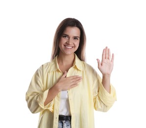 Photo of Woman making promise with raised hand on white background. Oath gesture