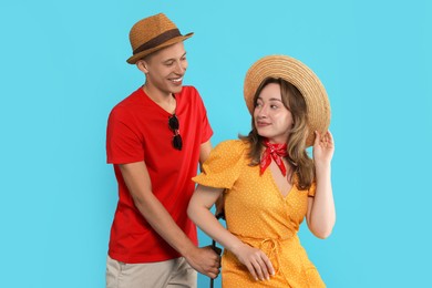 Photo of Happy young man and woman on light blue background