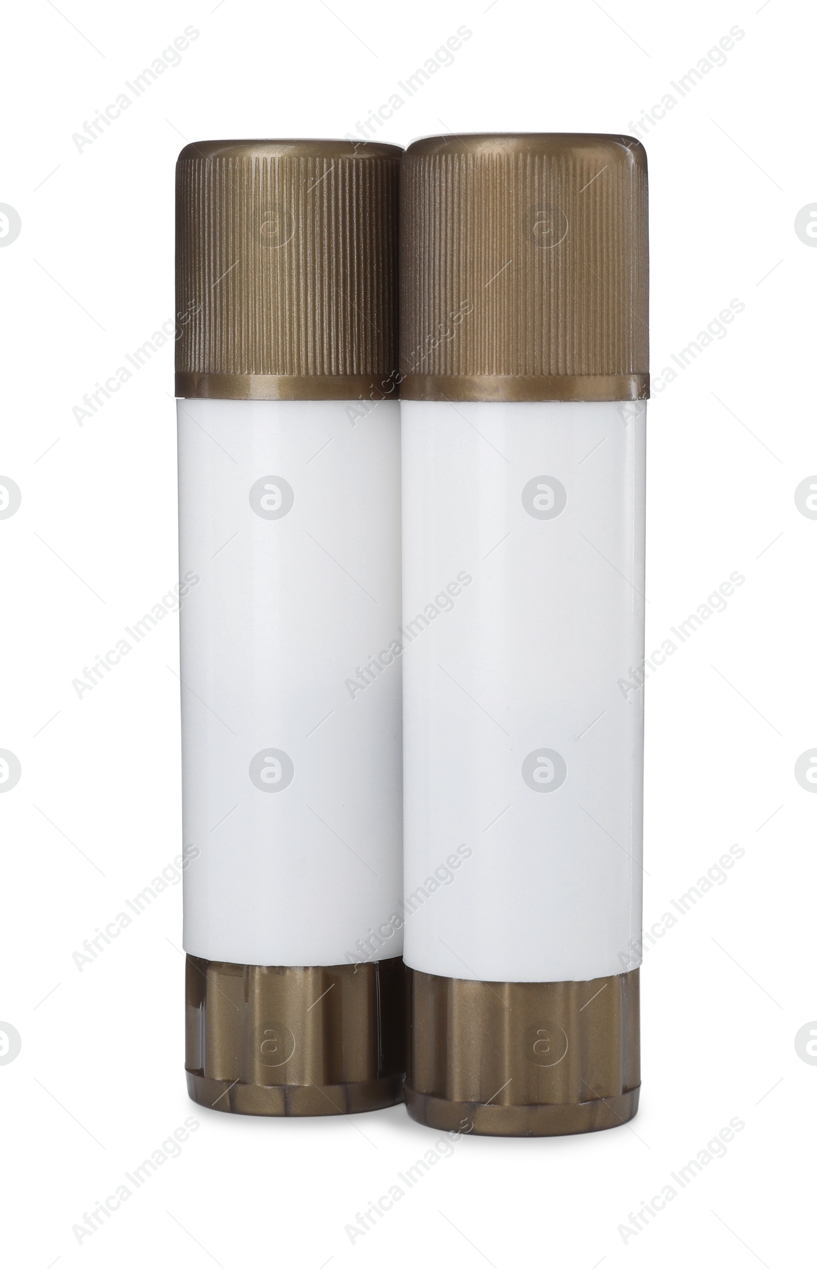 Photo of Two glue sticks with caps isolated on white