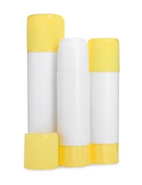 Photo of Many different glue sticks isolated on white