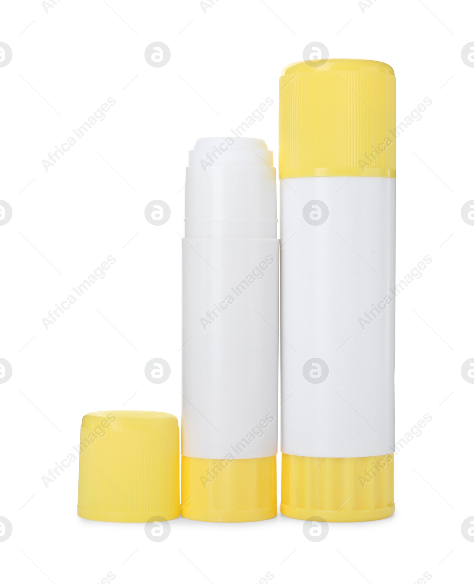 Photo of Two glue sticks with caps isolated on white